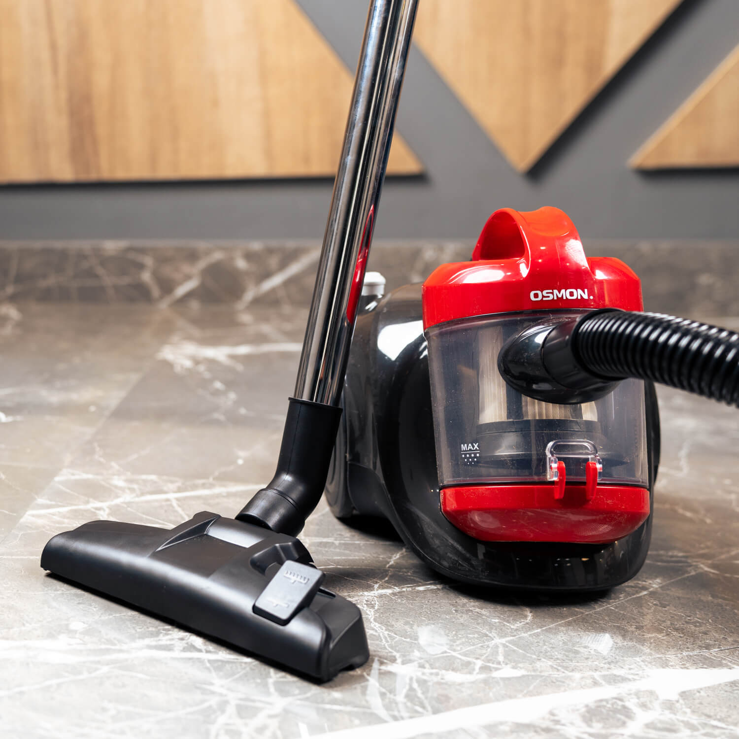 A sleek and powerful red and black vacuum cleaner, the Osmon 1400 Watt Bagless Cyclonic Vacuum Cleaner.